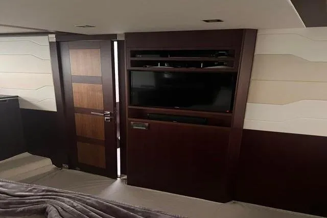 Slide: The Image of Luxurious interior of 2016 Galeon 660 Flybridge yacht with modern entertainment system. - 12