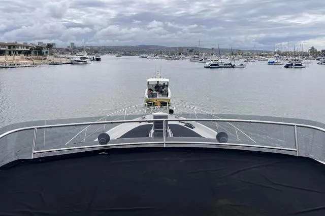 Slide: The Image of Galeon 660 Flybridge yacht on a cloudy day in a marina, 2016 model. - 16