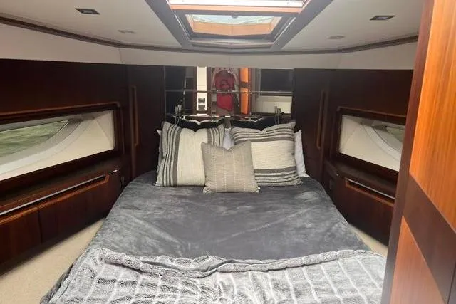 Slide: The Image of Luxurious bedroom interior of 2016 Galeon 660 Flybridge yacht with skylight and plush bedding. - 38
