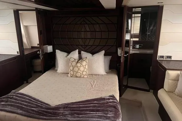 Slide: The Image of Luxurious bedroom interior of 2016 Galeon 660 Flybridge yacht with elegant bedding and decor. - 40