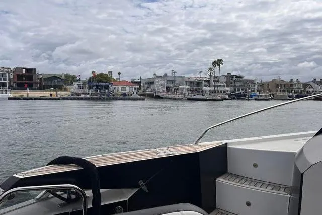Slide: The Image of Galeon 660 Flybridge yacht, 2016 model, docked with waterfront view and cloudy sky. - 41