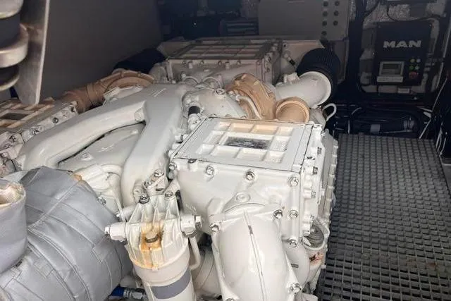 Slide: The Image of Engine room of 2016 Galeon 660 Flybridge yacht, featuring a MAN engine. - 45