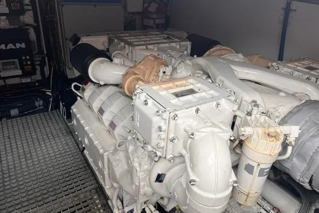 Slide: The Image of Engine room of 2016 Galeon 660 Flybridge yacht, featuring powerful marine engines. - 46