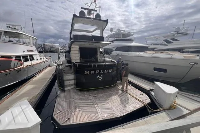 Slide: The Image of Galeon 660 Flybridge 2016 yacht docked at marina with overcast sky. - 5