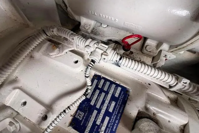 Slide: The Image of Engine compartment of 2016 Galeon 660 Flybridge with visible wiring and components. - 51