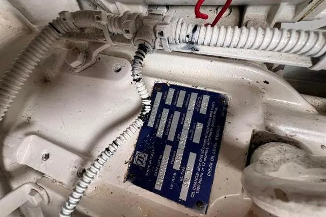 Slide: The Image of Engine compartment of 2016 Galeon 660 Flybridge with wiring and identification plate. - 52