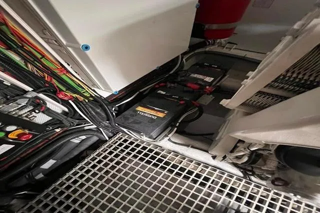 Slide: The Image of Engine room of 2016 Galeon 660 Flybridge with batteries and wiring. - 55