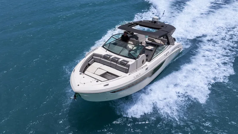 The Image of 2020 Cruisers Yachts 38 GLS OB cruising on open water, showcasing sleek design and performance. - 0