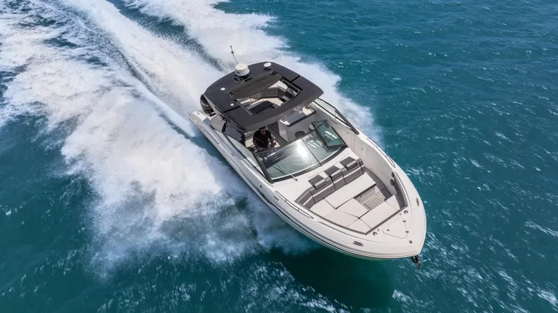 Slide: The Image of 2020 Cruisers Yachts 38 GLS OB speeding on blue ocean waters. - 12