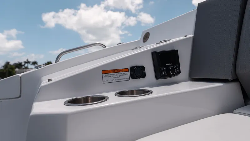 Slide: The Image of 2020 Cruisers Yachts 38 GLS OB interior detail with cup holders and control panel. - 17