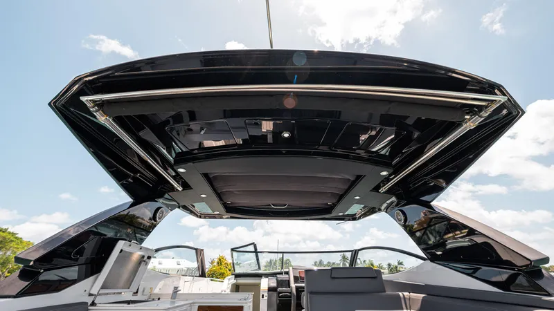 Slide: The Image of 2020 Cruisers Yachts 38 GLS OB boat interior with open sunroof, showcasing sleek design. - 26