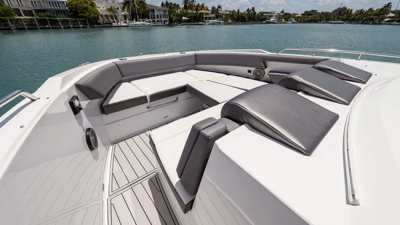 Slide: The Image of Luxurious seating area on 2020 Cruisers Yachts 38 GLS OB, overlooking serene waterfront. - 31
