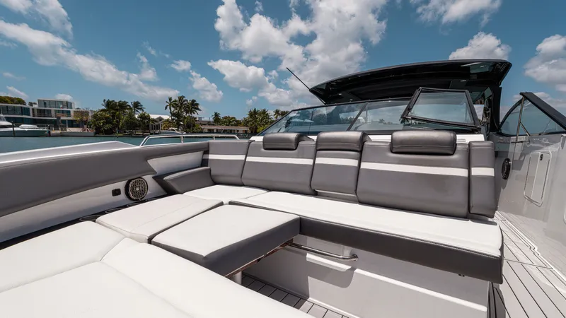 Slide: The Image of 2020 Cruisers Yachts 38 GLS OB with luxurious seating under a sunny sky. - 32