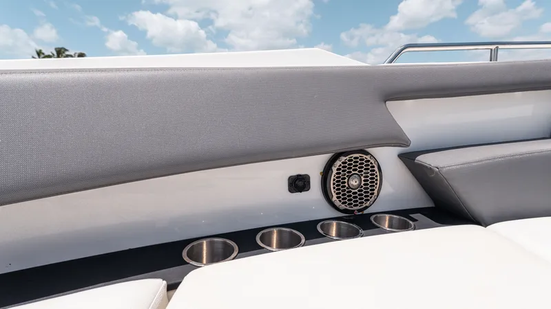 Slide: The Image of Interior of 2020 Cruisers Yachts 38 GLS OB, featuring cup holders and speaker. - 33