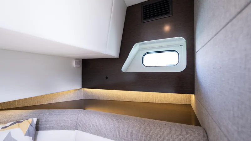 Slide: The Image of Interior cabin of 2020 Cruisers Yachts 38 GLS OB with modern design and window view. - 38