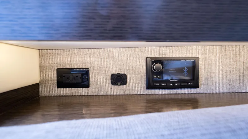 Slide: The Image of Control panel and audio system in 2020 Cruisers Yachts 38 GLS OB interior. - 39