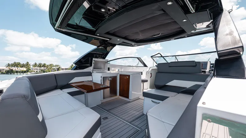 Slide: The Image of 2020 Cruisers Yachts 38 GLS OB interior with luxurious seating and modern amenities. - 19
