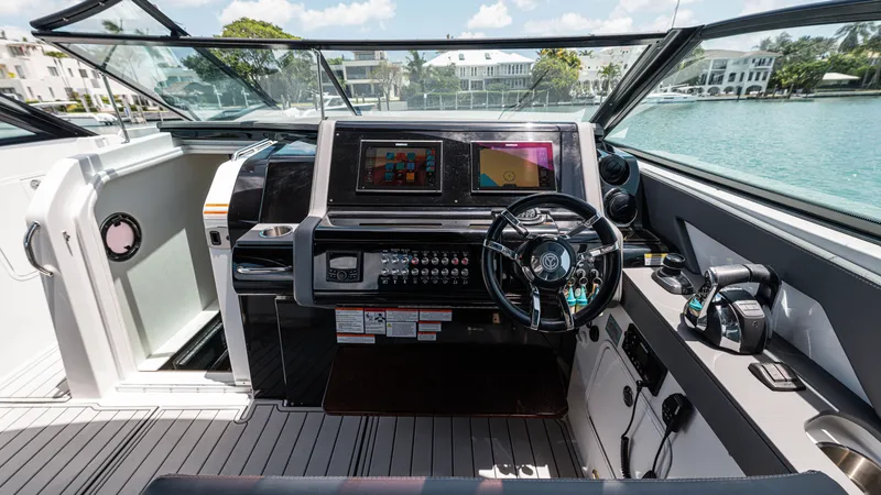 Slide: The Image of Cockpit of 2020 Cruisers Yachts 38 GLS OB with modern controls and dual displays. - 27