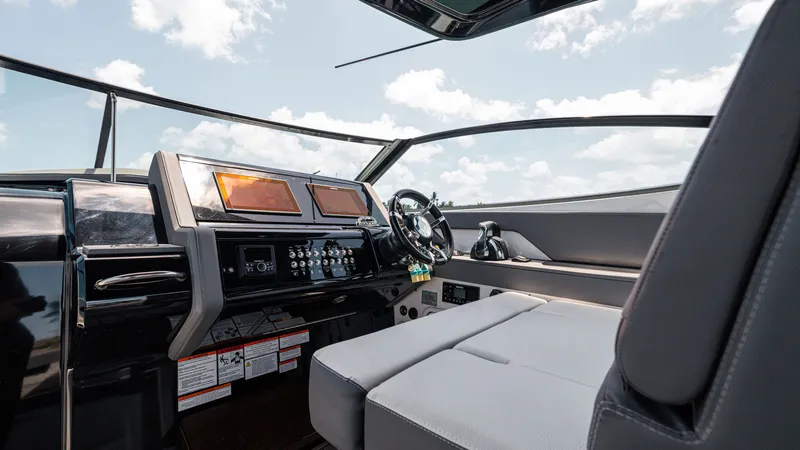 Slide: The Image of Cockpit of 2020 Cruisers Yachts 38 GLS OB with modern controls and seating. - 28