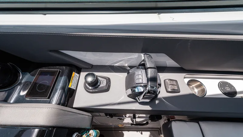 Slide: The Image of 2020 Cruisers Yachts 38 GLS OB helm controls with joystick and throttle. - 30