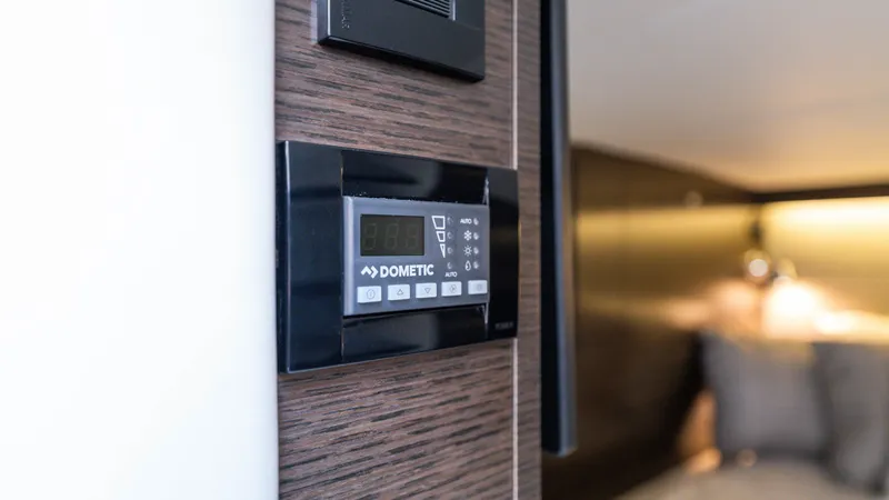 Slide: The Image of Dometic control panel on 2020 Cruisers Yachts 38 GLS OB interior wall. - 41