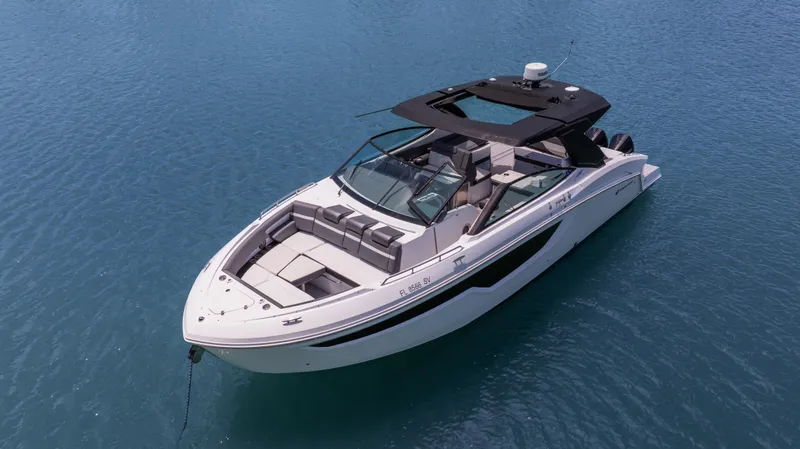 Slide: The Image of 2020 Cruisers Yachts 38 GLS OB on clear blue water, showcasing sleek design and luxury features. - 5