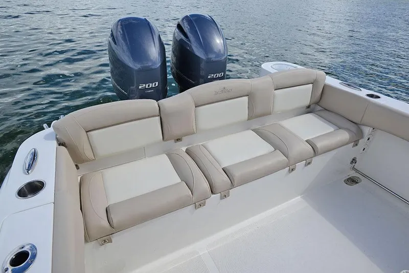 Slide: The Image of Manufacturer Provided Image: 2018 NauticStar 2602 Legacy boat with twin 200 HP engines and cushioned seating. - 18