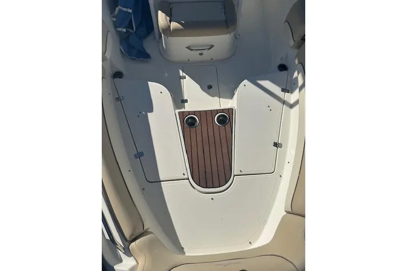 Slide: The Image of 2018 NauticStar 2602 Legacy boat deck with seating and storage compartments. - 20