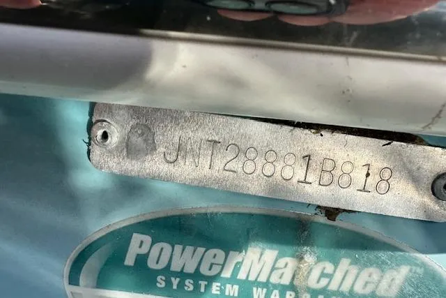 Slide: The Image of 2018 NauticStar 2602 Legacy boat identification plate with serial number and PowerMatched warranty sticker. - 32