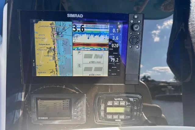 Slide: The Image of Simrad navigation system on 2018 NauticStar 2602 Legacy boat dashboard. - 35