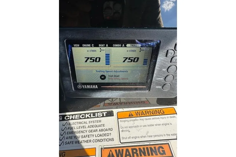 Slide: The Image of Yamaha engine display on 2018 NauticStar 2602 Legacy, showing 750 RPM trolling speed. - 36