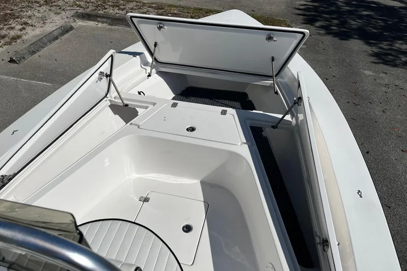 Slide: The Image of 2022 Piranha Alem F2000 boat with open storage compartments, showcasing sleek design and functionality. - 13