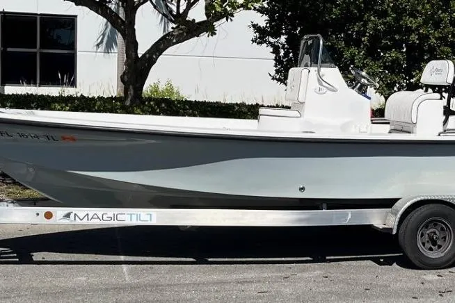 Slide: The Image of 2022 Piranha Alem F2000 boat on Magic Tilt trailer, parked outdoors. - 15