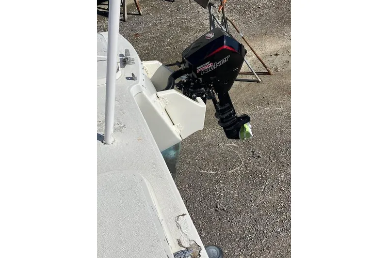 Slide: The Image of Interior of 1981 Witness Catamaran featuring dual stainless steel sinks in a rustic setting. - 13