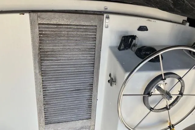 Slide: The Image of Interior of 1981 Witness Catamaran showing worn shelves and damaged surfaces. - 15