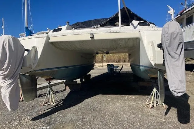 Slide: The Image of 1981 Witness Catamaran "Homewind" from Mobile, AL, docked with ladder and covered propeller. - 5