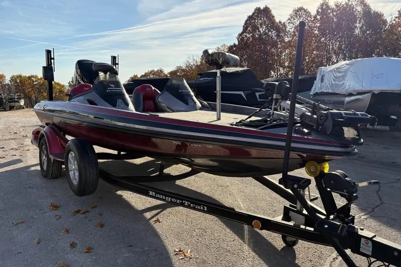 Slide: The Image of 2011 Ranger Z118 Comanche boat on trailer in outdoor setting. - 5