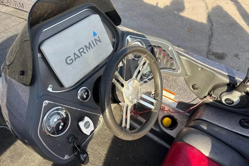 Slide: The Image of 2011 Ranger Z118 Comanche boat dashboard with Garmin navigation system and steering wheel. - 8
