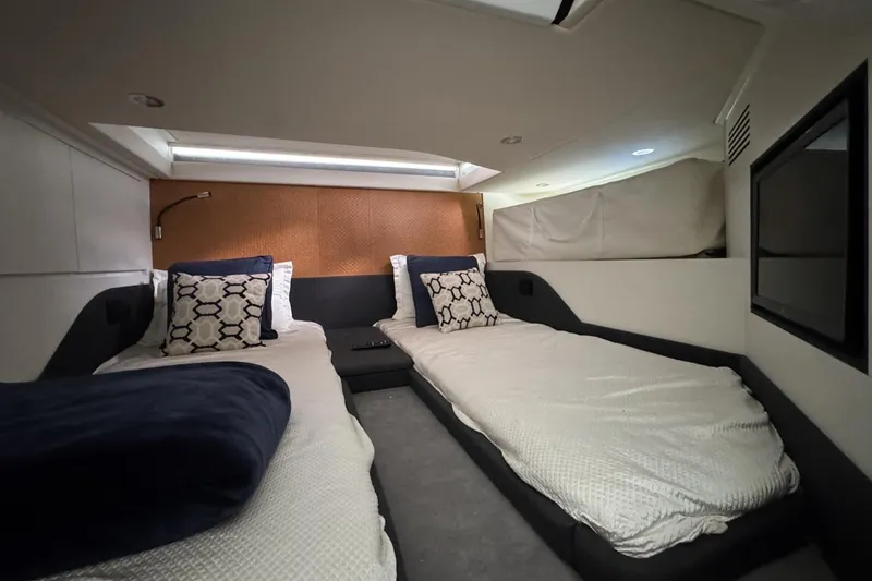 Slide: The Image of 2023 Azimut Verve 47 cabin interior with twin beds and modern decor. - 102