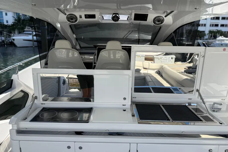 Slide: The Image of 2023 Azimut Verve 47 yacht interior with open storage and modern amenities. - 23