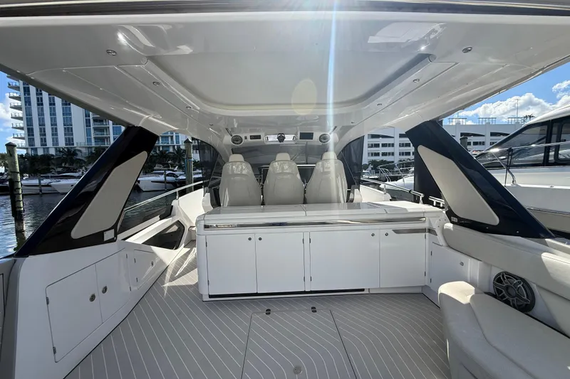 Slide: The Image of 2023 Azimut Verve 47 boat interior with beige seating and speaker detail. - 29