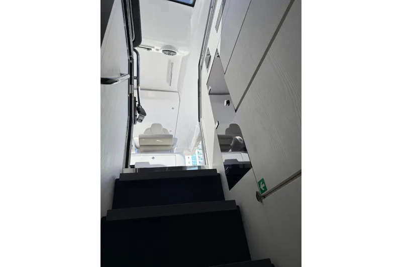 Slide: The Image of Open storage compartment on 2023 Azimut Verve 47 yacht with cleaning supplies. - 31