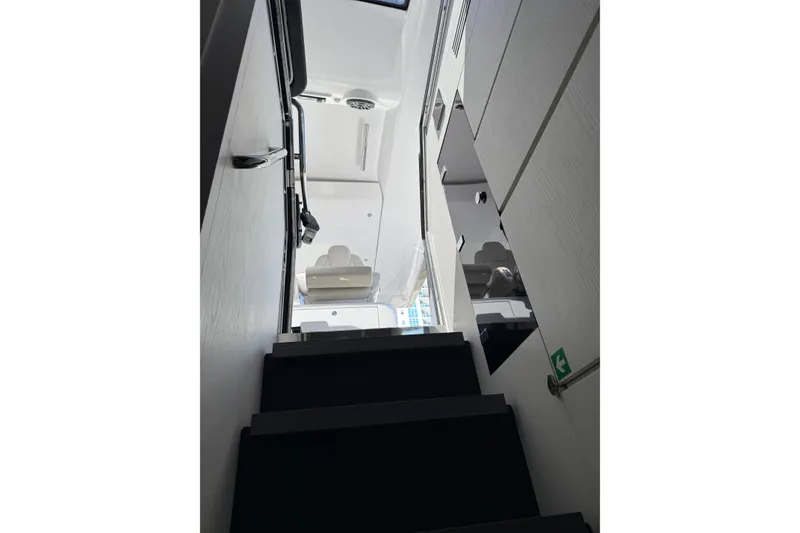 Slide: The Image of 2023 Azimut Verve 47 yacht storage compartment with cleaning supplies on deck. - 32