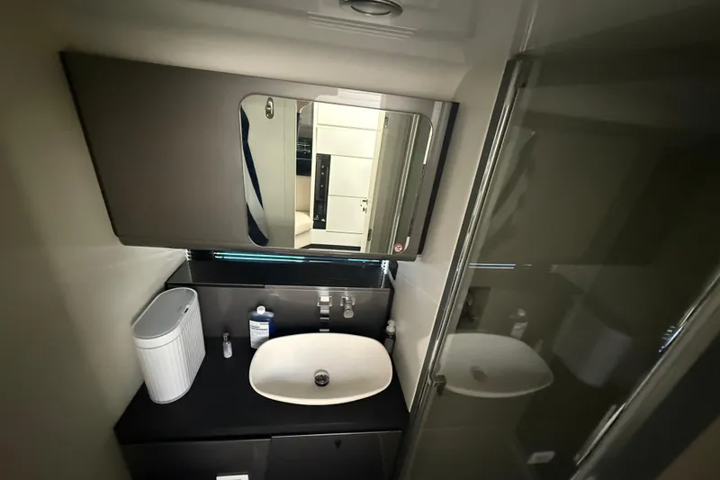 Slide: The Image of 2023 Azimut Verve 47 yacht helm with advanced navigation displays and controls. - 40