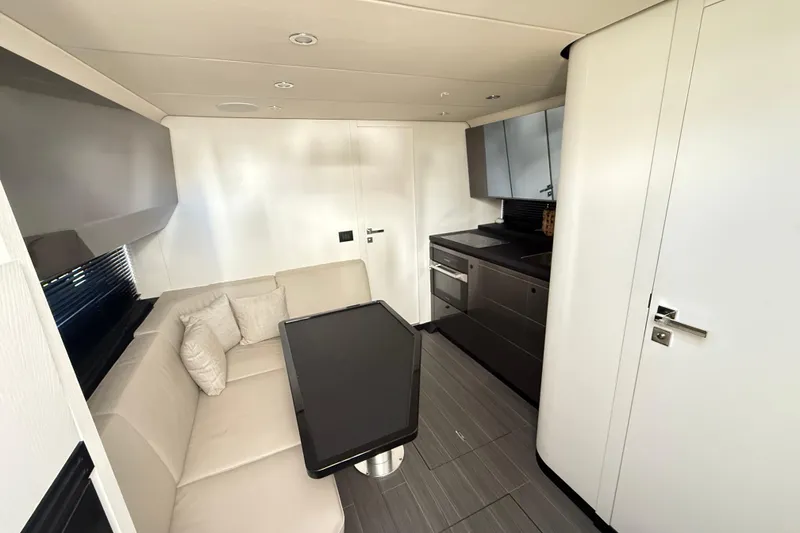 Slide: The Image of Cockpit view of 2023 Azimut Verve 47 yacht docked at marina. - 43