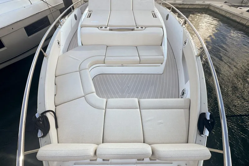 Slide: The Image of Luxurious seating area on 2023 Azimut Verve 47 yacht, docked by the water. - 50