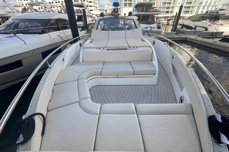 Slide: The Image of 2023 Azimut Verve 47 luxury yacht with spacious deck and elegant seating at marina. - 52