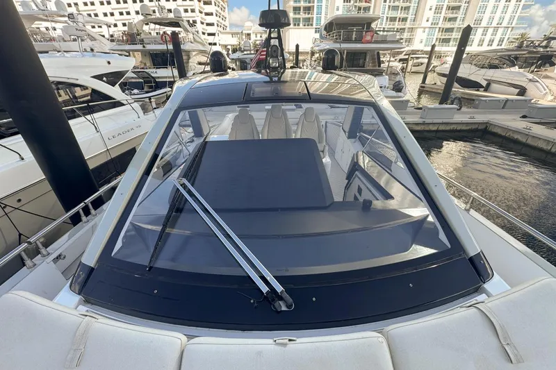 Slide: The Image of 2023 Azimut Verve 47 yacht docked at marina, showcasing sleek design and luxury features. - 58