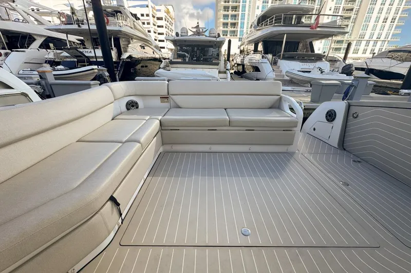 Slide: The Image of 2023 Azimut Verve 47 yacht interior with spacious seating and modern design at a marina. - 63