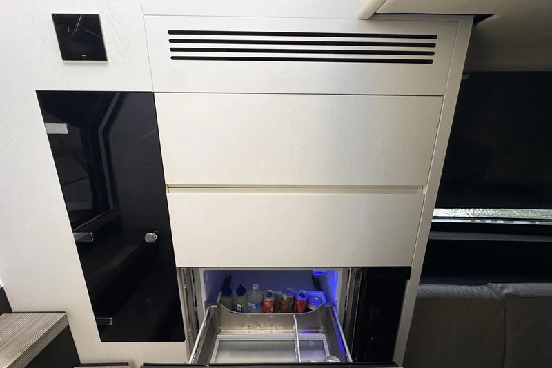 Slide: The Image of Modern interior of 2023 Azimut Verve 47 yacht with built-in refrigerator drawer. - 69